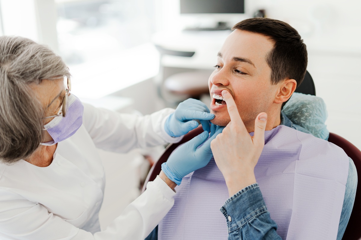 Patient receiving a routine dental checkup